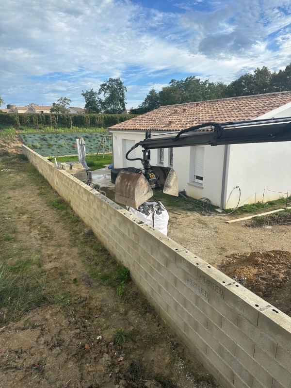 Évacuation de terre plus livraison de   pavé